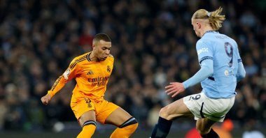 Real Madrid's Kylian Mbappe (L) in action with Manchester City's Erling Haaland during the Champions League knockout phase playoffs first leg match at the Etihad Stadium, Manchester, U.K., Feb. 11, 2025. (Reuters Photo)
