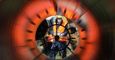 Workers are seen through a pipe at a construction site on the extension of Russia's TurkStream gas pipeline in Letnitsa, Bulgaria, June 1, 2020. (Reuters Photo)