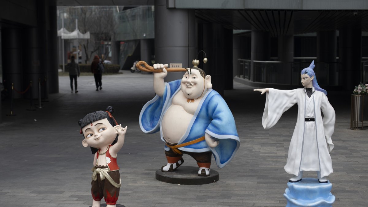 Models of the characters Nezha (L), Taiyi Zhenren (C) and Ao Bing from the animation Ne Zha saga are seen in Beijing, China, Feb. 11, 2025. (EPA Photo)