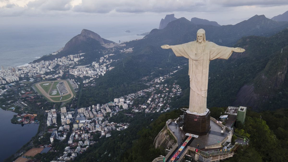Rugs made from colored salt and sustainable materials lay before the Christ the Redeemer statue before a Catholic Mass celebrating Corpus Christi, Rio de Janeiro, Brazil, May 30, 2024. (AP Photo)