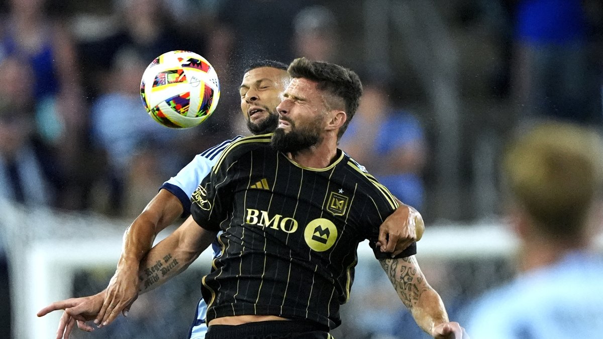 Los Angeles FC's Olivier Giroud battles Sporting Kansas City's Joaquin Fernandez for the ball during the first half of an MLS match Saturday, Kansas City, U.S., Oct. 5, 2024. (AP Photo)