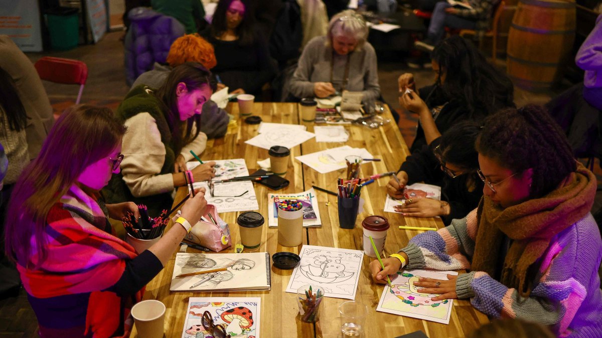 People read, write and draw in silence while listening to pianist Maria Garzon during the ‘Connect with Yourself’ segment of an event at the Sherriff Centre in London, U.K., Feb. 12, 2025. (AFP Photo)