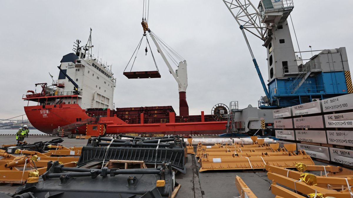 Workers move a cargo of aluminum blocks at a commercial port in Vladivostok, Russia, April 6, 2023. (Reuters Photo)