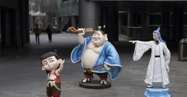 Models of the characters Nezha (L), Taiyi Zhenren (C) and Ao Bing from the animation Ne Zha saga are seen in Beijing, China, Feb. 11, 2025. (EPA Photo)