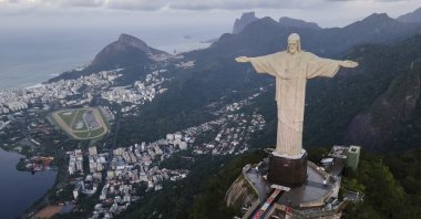Rugs made from colored salt and sustainable materials lay before the Christ the Redeemer statue before a Catholic Mass celebrating Corpus Christi, Rio de Janeiro, Brazil, May 30, 2024. (AP Photo)