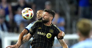 Los Angeles FC&#039;s Olivier Giroud battles Sporting Kansas City&#039;s Joaquin Fernandez for the ball during the first half of an MLS match Saturday, Kansas City, U.S., Oct. 5, 2024. (AP Photo)