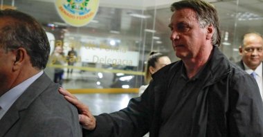 Former Brazil's President Jair Bolsonaro arrives at the Federal Senate to have lunch with leaders of opposition parties in Brasilia on February 18, 2025. (Photo by Sergio Lima / AFP)