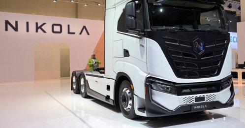 A member of the media stands behind a hydrogen-powered Artic truck at the booth of U.S. truckmaker Nikola at the IAA Transportation fair in Hanover, Germany, Sept. 19, 2022. (Reuters Photo)