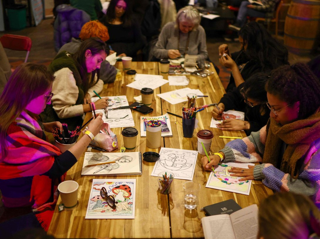 People read, write and draw in silence while listening to pianist Maria Garzon during the ‘Connect with Yourself’ segment of an event at the Sherriff Centre in London, U.K., Feb. 12, 2025. (AFP Photo)