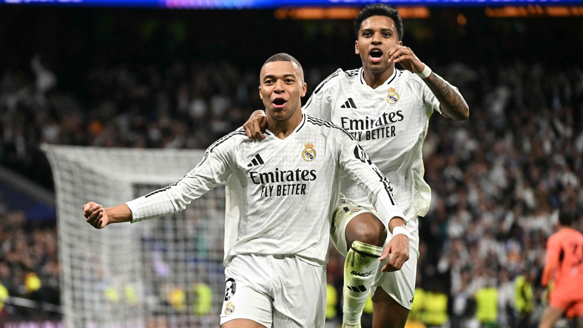 Real Madrid&#039;s Kylian Mbappe celebrates scoring his team&#039;s second goal, with his teammate Rodrygo, during the UEFA Champions League knockout phase playoff match at the Santiago Bernabeu stadium, Madrid, Spain, Feb. 19, 2025. (AFP Photo)
