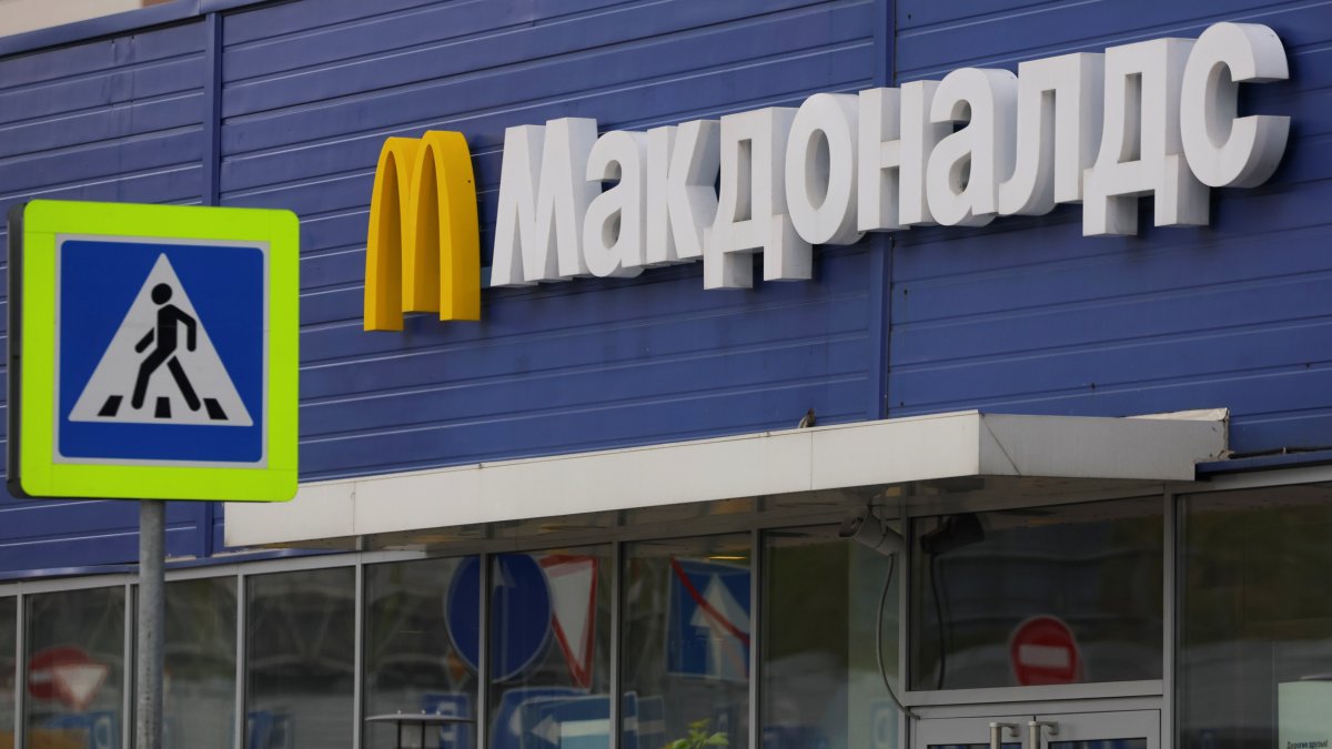 A sign with the logo is on display near a McDonald&#039;s restaurant in Moscow, Russia, May 16, 2022. (Reuters Photo)