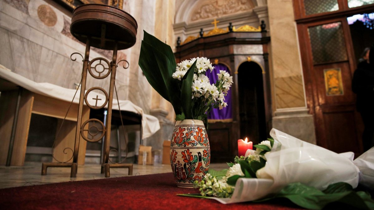 Flowers are placed inside the Italian Santa Maria Catholic Church a day after an attack during the Sunday service, in which one person was killed, Istanbul, Türkiye, Jan. 9, 2024. (Reuters Photo)