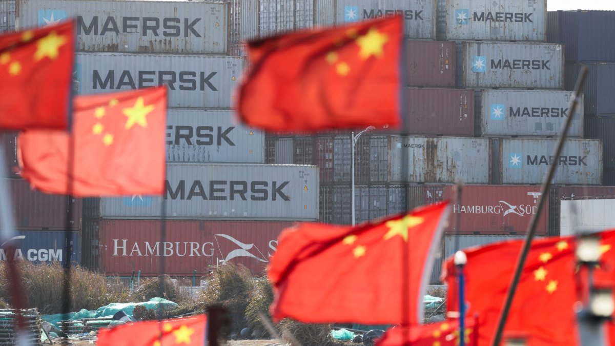 Chinese national flags flutter near shipping containers at the Yangshan Port outside Shanghai, China, Feb. 7, 2025. (Reuters Photo)