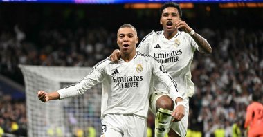 Real Madrid's Kylian Mbappe celebrates scoring his team's second goal, with his teammate Rodrygo, during the UEFA Champions League knockout phase playoff match at the Santiago Bernabeu stadium, Madrid, Spain, Feb. 19, 2025. (AFP Photo)