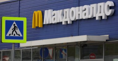 A sign with the logo is on display near a McDonald&#039;s restaurant in Moscow, Russia, May 16, 2022. (Reuters Photo)