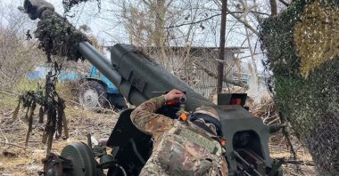 A Russian serviceman aims a D-30 howitzer toward Ukrainian positions in the border area of Kursk region, Russia, Nov. 29, 2024. (AP Photo)