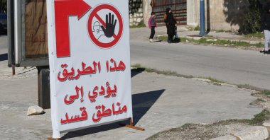 A sign warns people against entering a YPG-controlled neighborhood, Aleppo, Syria, Feb. 20, 2025. (AA Photo)
