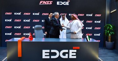 Officials shake hands at the ceremony as Turkish defense company FNSS inks a memorandum of understanding with AL TAIF, an entity of the EDGE Group, to modernize the UAE&#039;s armored fleet, Abu Dhabi, UAE, Feb. 20, 2025. (AA Photo)