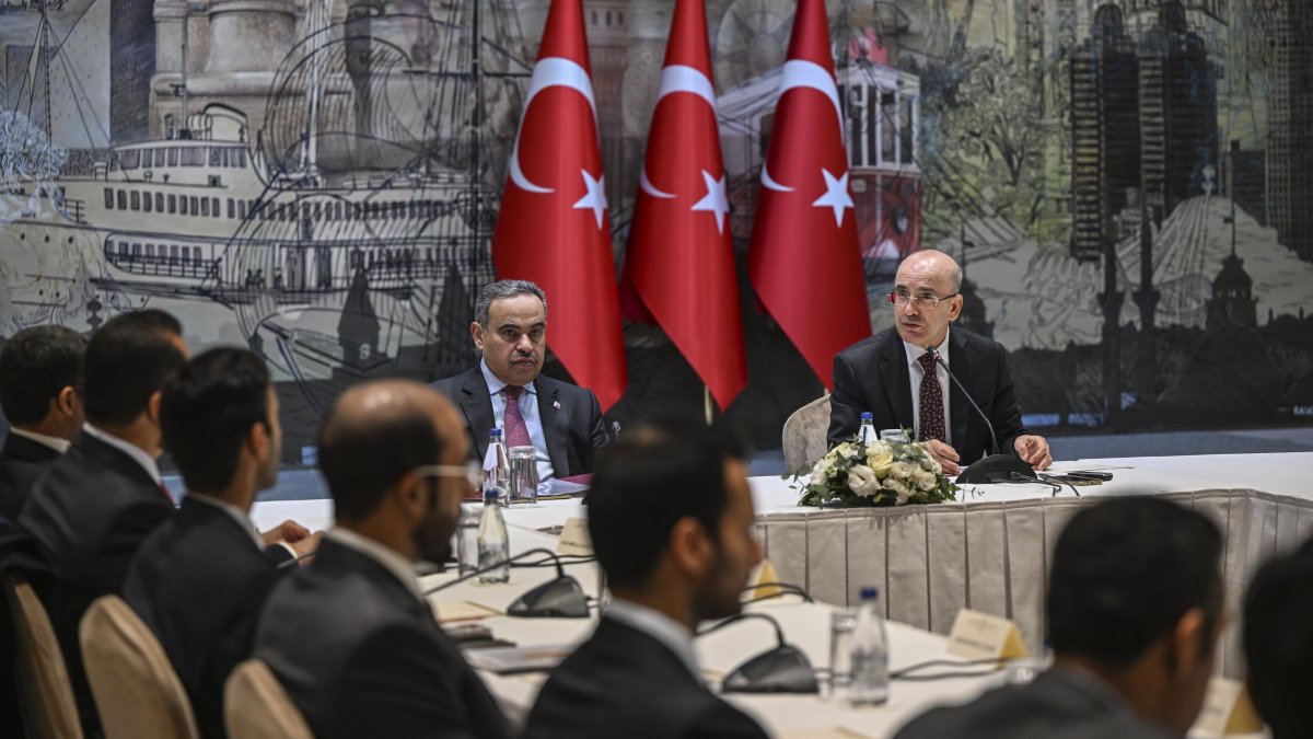 Treasury and Finance Minister Mehmet Şimşek (R) and his Qatari counterpart Ali bin Ahmed Al Kuwari attend the Türkiye-Qatar Joint Economic Commission meeting in Istanbul, Türkiye, Feb. 21, 2025. (AA Photo)