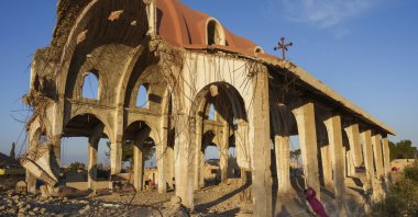 Children play in the ruins of the Church of the Virgin Mary, which was destroyed by Daesh in 2015, Tel Nasri, Syria, Jan. 27, 2025. (AP Photo)