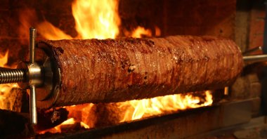 Cağ kebabı (pictured) is a traditional dish from Erzurum, made with marinated lamb or beef cooked on a vertical rotisserie, served with flatbread. (Shutterstock Photo)