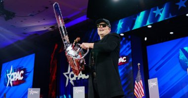 U.S. special government employee Elon Musk with a chainsaw given to him by Argentine President Javier Milei at the Conservative Political Action Conference (CPAC) 2025 at National Harbor, Maryland, Feb. 20, 2025. (EPA Photo)