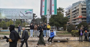 People watch as Syrian soldiers take part in a military parade organized by the Syrian Ministry of Defense following the graduation of over 300 soldiers in the city of Aleppo, northern Syria, Feb. 12, 2025. (EPA Photo)