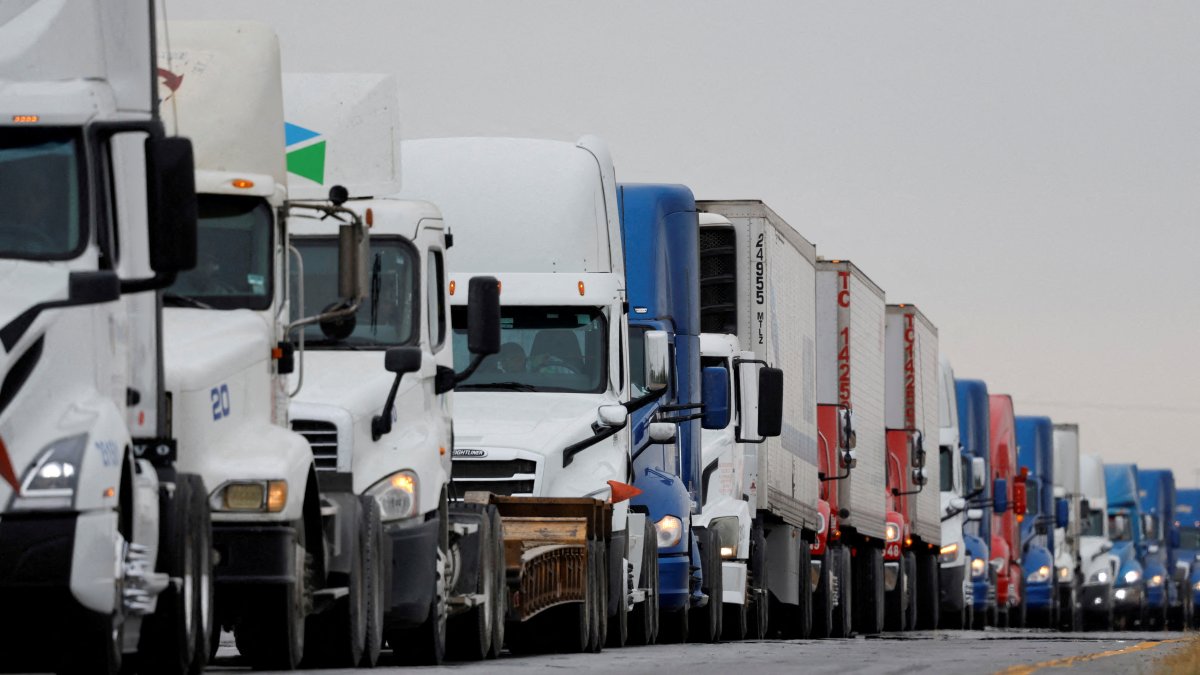 Trucks wait in line to cross into the United States near the border customs control at the World Trade Bridge, Nuevo Laredo, Mexico, Nov. 26, 2024. (Reuters Photo)