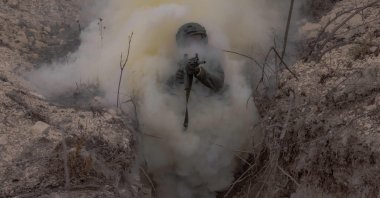 A Ukrainian serviceman moves through a trench during a military training exercise in the eastern Donetsk region, Ukraine, Feb. 3, 2025. (AFP Photo)