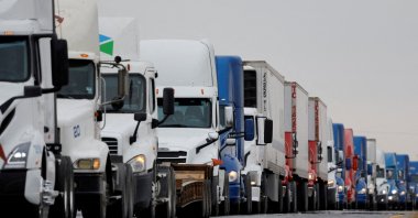 Trucks wait in line to cross into the United States near the border customs control at the World Trade Bridge, Nuevo Laredo, Mexico, Nov. 26, 2024. (Reuters Photo)
