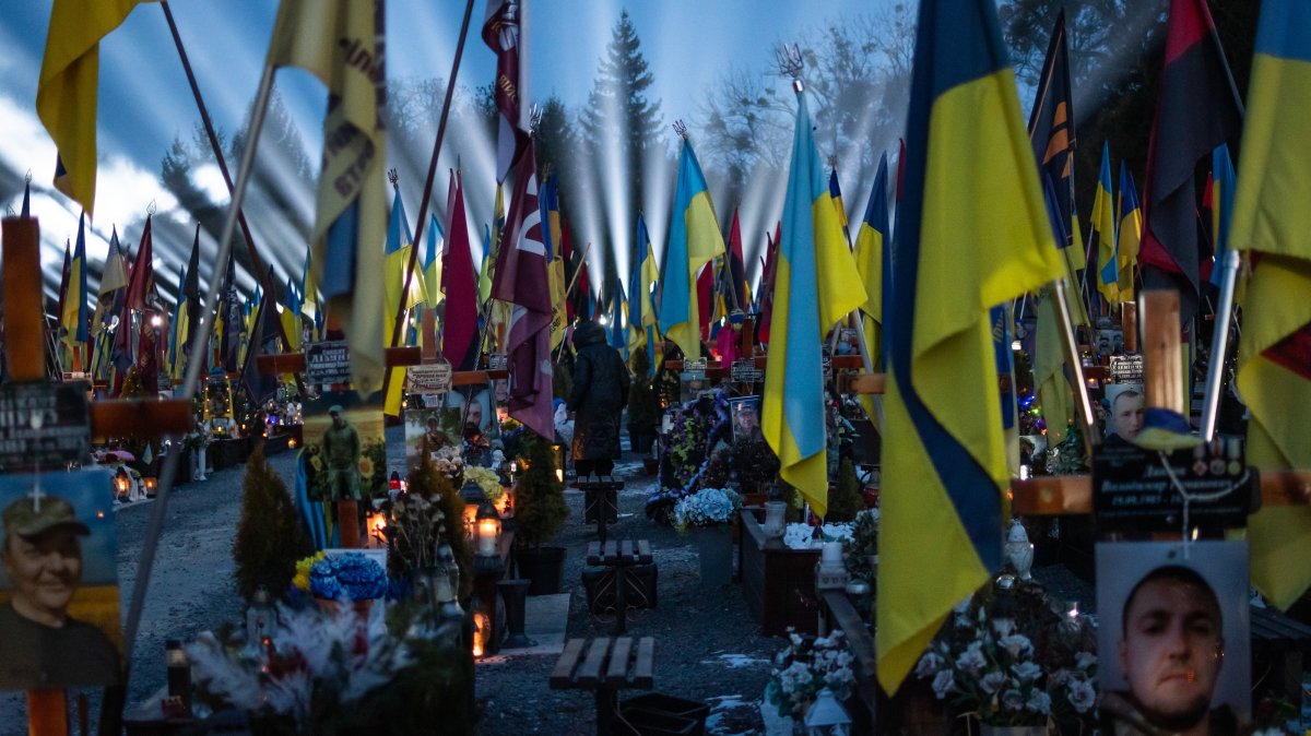 Citizens and families of Ukrainian soldiers killed in the Russia-Ukraine war, take part in a memorial in Lviv, Ukraine, Feb. 23, 2025. (AA Photo)