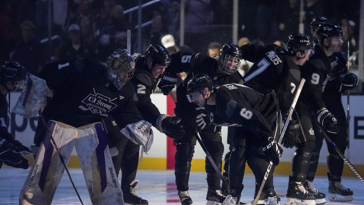 Team Black player singer Justin Bieber high fives teammates during the Skate for LA Strong celebrity hockey game, Los Angeles, U.S., Feb. 23, 2025. (AP Photo)
