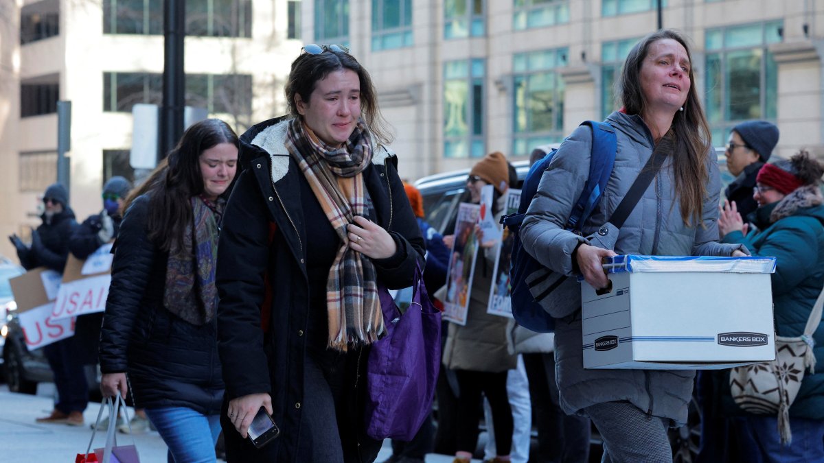 Recently fired USAID staff react as they leave work during a sendoff outside its offices in Washington, D.C., U.S., Feb. 21, 2025. (Reuters Photo)