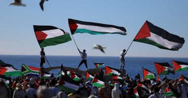 Pro-Palestinian demonstrators hold Palestinian flags, as they take part in a protest against U.S. President Donald Trump&#039;s plan to resettle Palestinians from Gaza, Cape Town, South Africa, Feb. 22, 2025. (Reuters Photo)