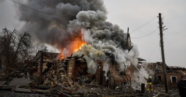 Ukrainian rescuers work at the site of a rocket attack on a building, Kharkiv, northeastern Ukraine, Jan. 23, 2024. (EPA Photo)