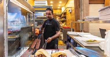 A man prepares kebab in Büyüksaat, located in Adana Kazancılar Bazaar, Adana, Türkiye, April 19, 2024. (Shutterstock Photo) 