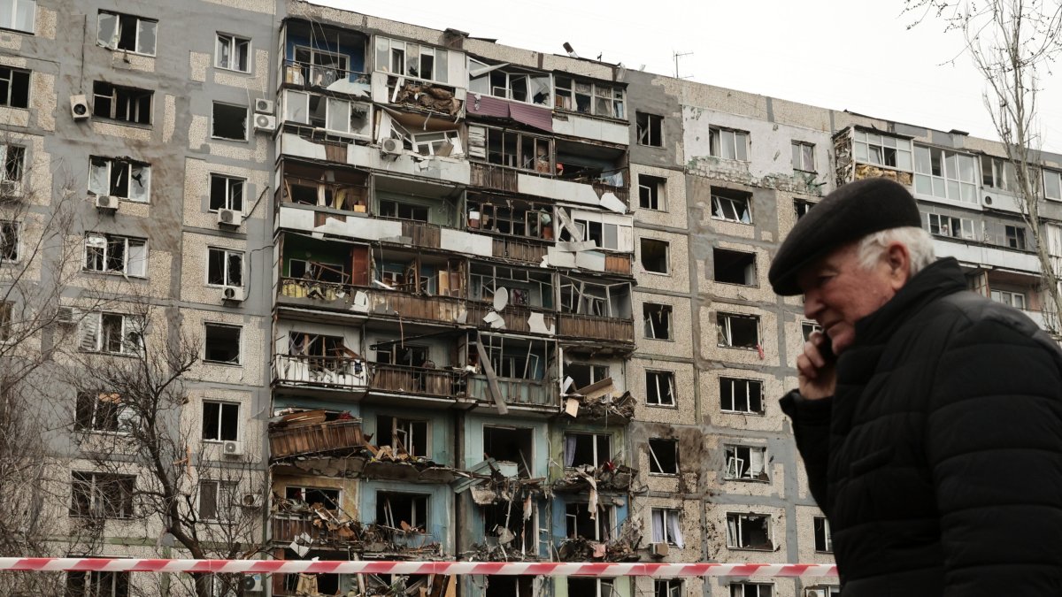 A man walks past the scene of a missile strike near a residential building, Zaporizhzhia, Ukraine, March 22, 2024. (EPA Photo)
