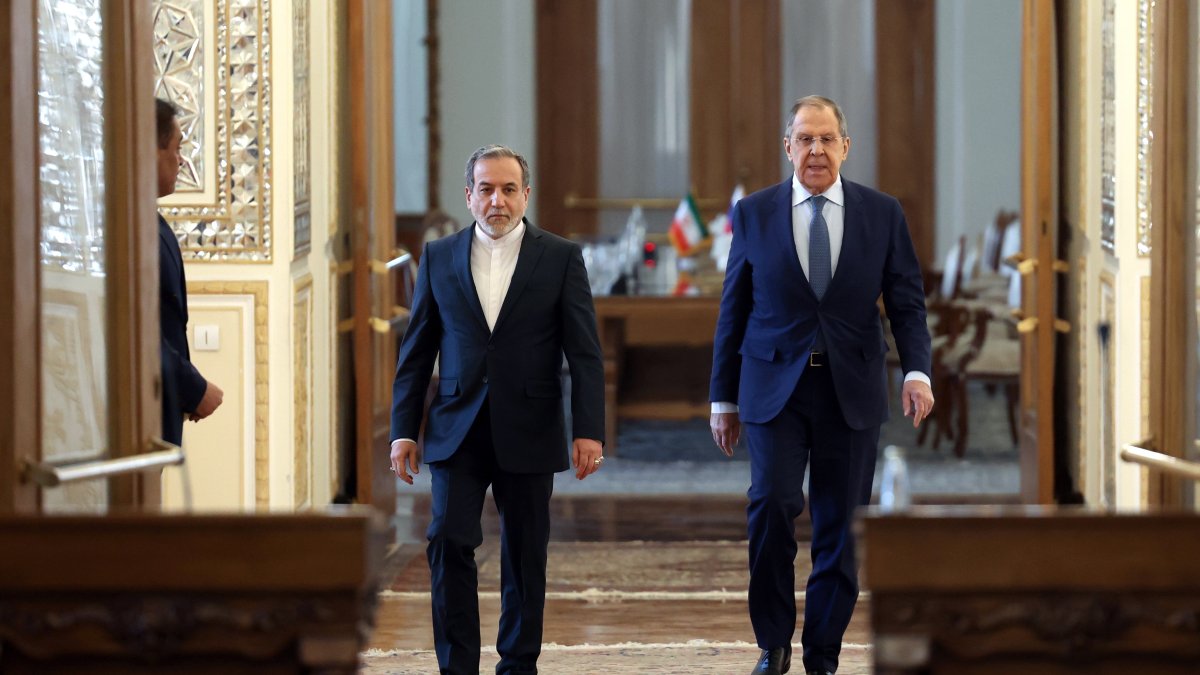 Iranian Foreign Minister Abbas Araghchi and his Russian counterpart Sergey Lavrov arrive for a joint news conference in Tehran, Iran, Feb. 25, 2025. (EPA Photo)