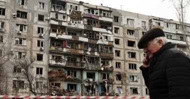 A man walks past the scene of a missile strike near a residential building, Zaporizhzhia, Ukraine, March 22, 2024. (EPA Photo)