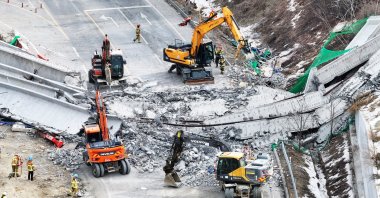 Rescuers work at the construction site of a bridge on the Seoul-Sejong expressway after it collapsed earlier in the day, leaving three workers dead and five others injured, Anseong, South Korea, Feb. 25, 2025. (EPA Photo)