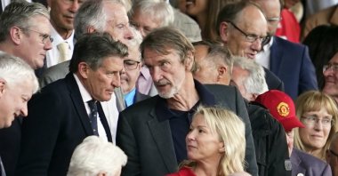 Jim Ratcliffe (C) in the stands during the English Premier League match between Manchester United and Arsenal at the Old Trafford Stadium, Manchester, England, May 12, 2024. (AP Photo)
