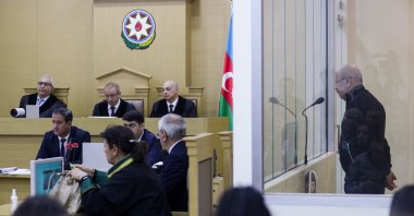 Vagif Khachatryan speaks via a translator for his criminal case initiated in Azerbaijan due to the events of Dec. 22, 1991, when a group of armed Armenians attacked the village of Meshali in the Khojaly region. Khachatryan was charged under Articles 103 (genocide) and 107 (deportation or forced relocation of the population) of the Criminal Code of Azerbaijan, Baku, Azerbaijan, Oct.17, 2023. (Getty Images)