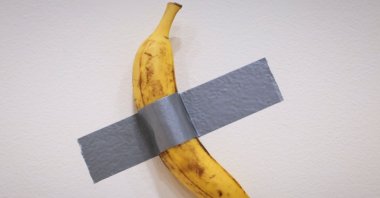 Italian visual artist Maurizio Cattelan&#039;s duct-taped Banana entitled &quot;Comedian&quot; is on display during a media preview at Sotheby&#039;s in New York, U.S., Nov. 8, 2024. (AFP Photo)