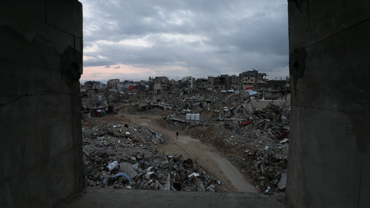 Palestinians walk among the rubble of buildings destroyed by Israeli airstrikes in Khan Younis, in the southern Gaza Strip, Palestine, Feb. 24, 2025. (Reuters Photo)