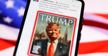 The White House&#039;s official &quot;X&quot; account is displayed on a mobile phone screen with the U.S. flag in the background, Krakow, Poland, Feb. 20, 2025. (Getty Images Photo)