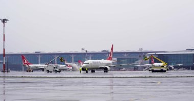 Turkish Airlines aircraft are photographed on the tarmac of Istanbul Airport on a rainy day, Istanbul, Türkiye, Feb. 11, 2025. (DHA Photo)