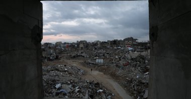 Palestinians walk among the rubble of buildings destroyed by Israeli airstrikes in Khan Younis, in the southern Gaza Strip, Palestine, Feb. 24, 2025. (Reuters Photo)