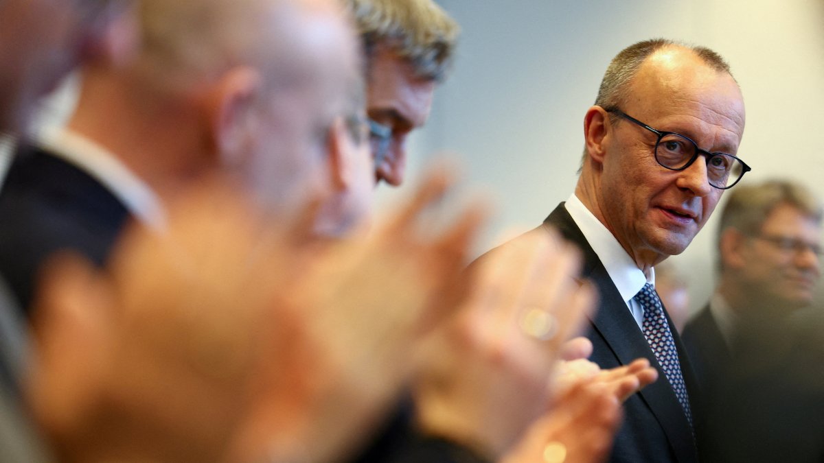 Christian Democratic Union (CDU) leader Friedrich Merz looks on as he is greeted with applause by the CDU and Christian Social Union (CSU) members before the start of their parliamentary fraction meeting following the German general elections, Berlin, Germany, Feb. 25, 2025. (Reuters Photo)