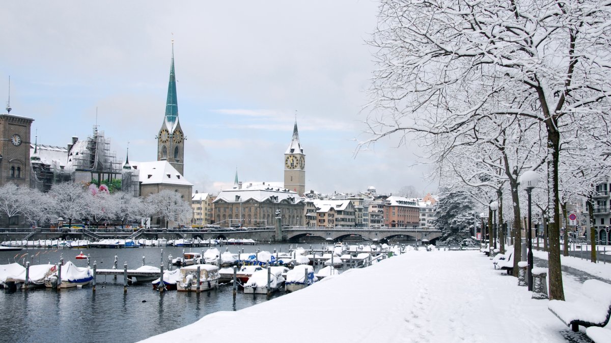 Zurich transforms into a magical haven during winter, where the charm of snow-covered streets blends seamlessly with the warmth of inviting cafes and cultural landmarks. (Shutterstock Photo)