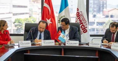 DEIK Türkiye-Latin America and Caribbean Business Councils Vice President Galip Ilter (L) and Secretary of the Board of Directors of the Chamber of Commerce of Guatemala (CCG) Luis Gomez ink a memorandum during a business meeting, Guatemala City, Guatemala, Feb. 25, 2025. (Courtesy of Guatemalan Embassy in Ankara)